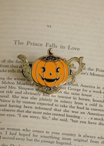 jack-o-lanturn pumpkin pin on book