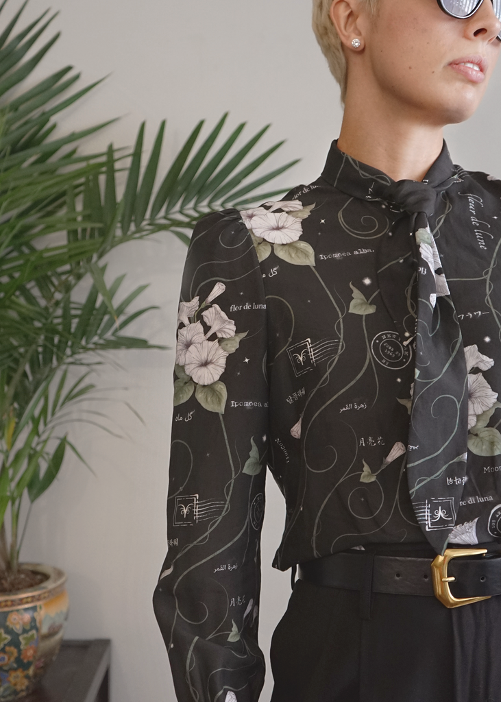 Amy wearing the poet shirt in the midnight magic print