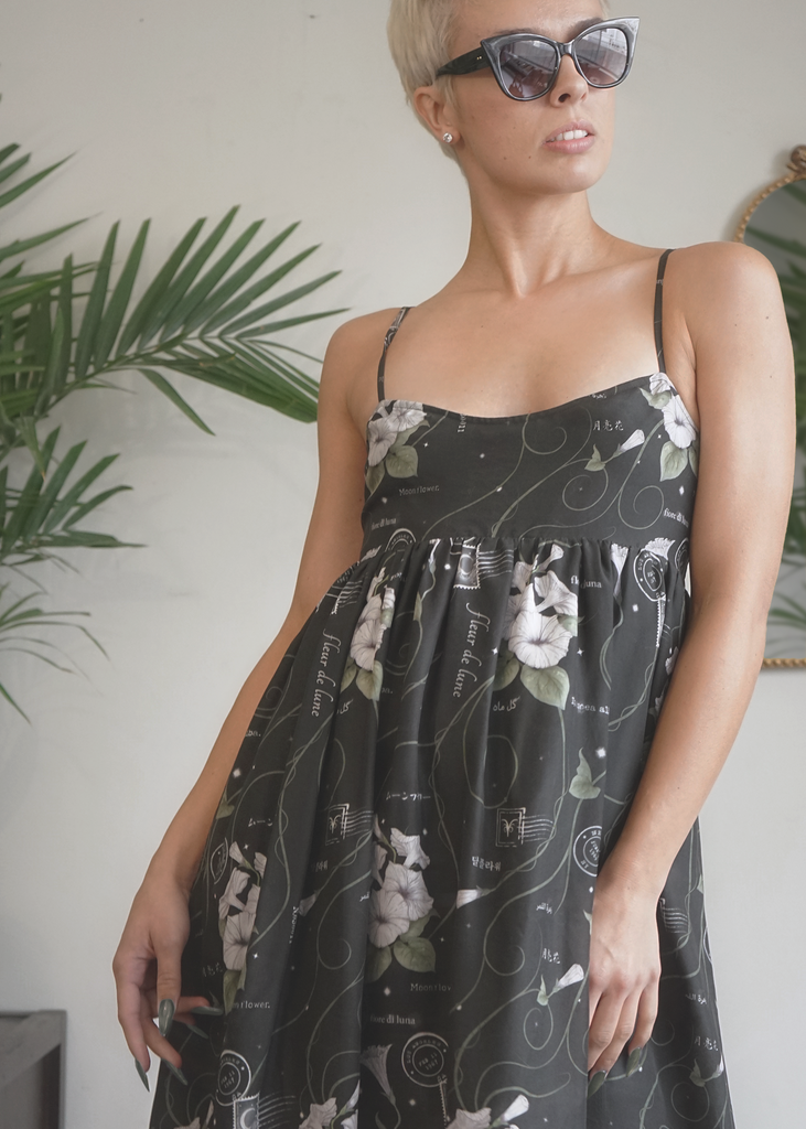 Close up of model wearing Marili dress in midnight magic print