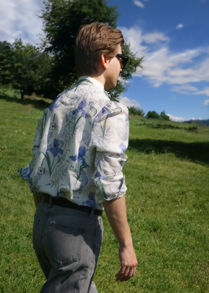 Back of model Thomas wearing poet shirt in Iris Botany print