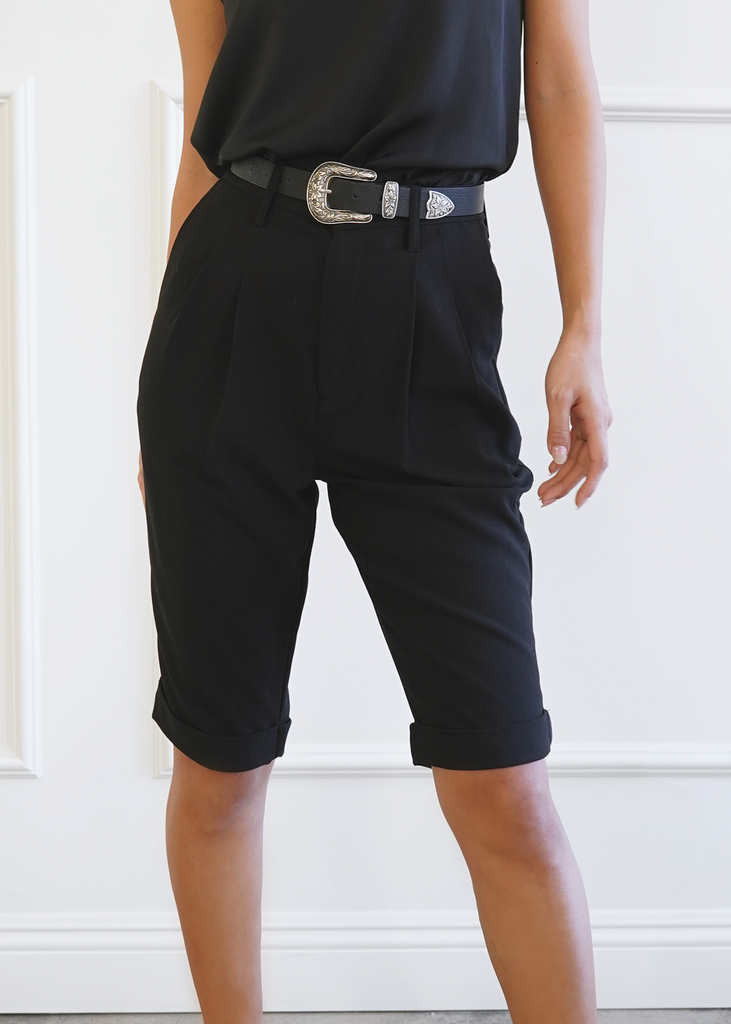 Front of double pleated mid Length trousers