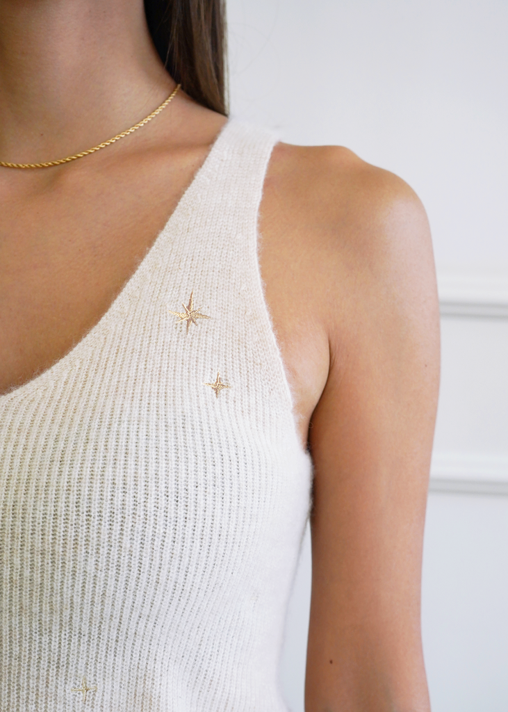 Close up shot of star embroidery on Vienna cashmere tank in 24KT gold stars