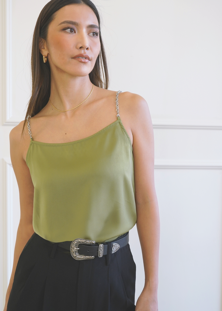 Close up of model wearing Carnal Cami in Olive tucked in